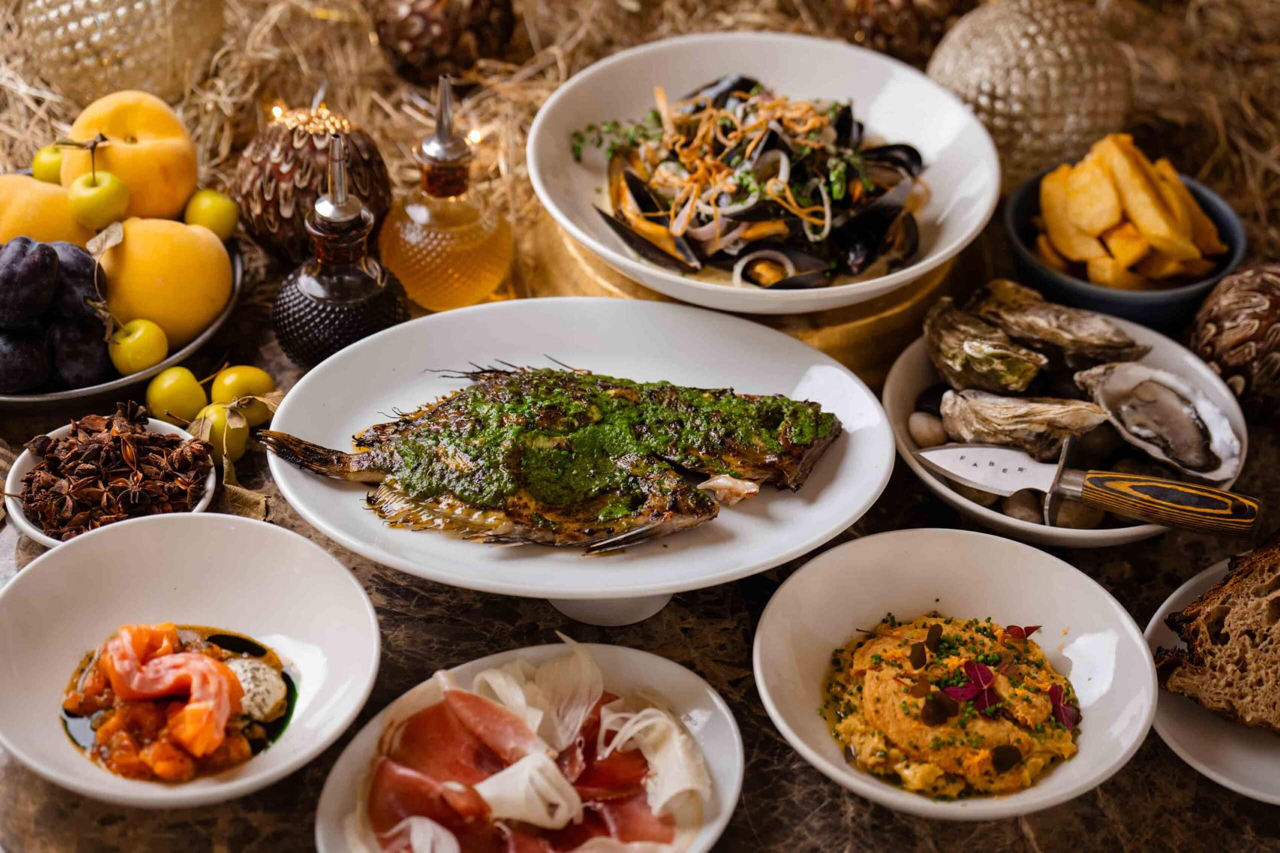 A table full of many different fish based dishes