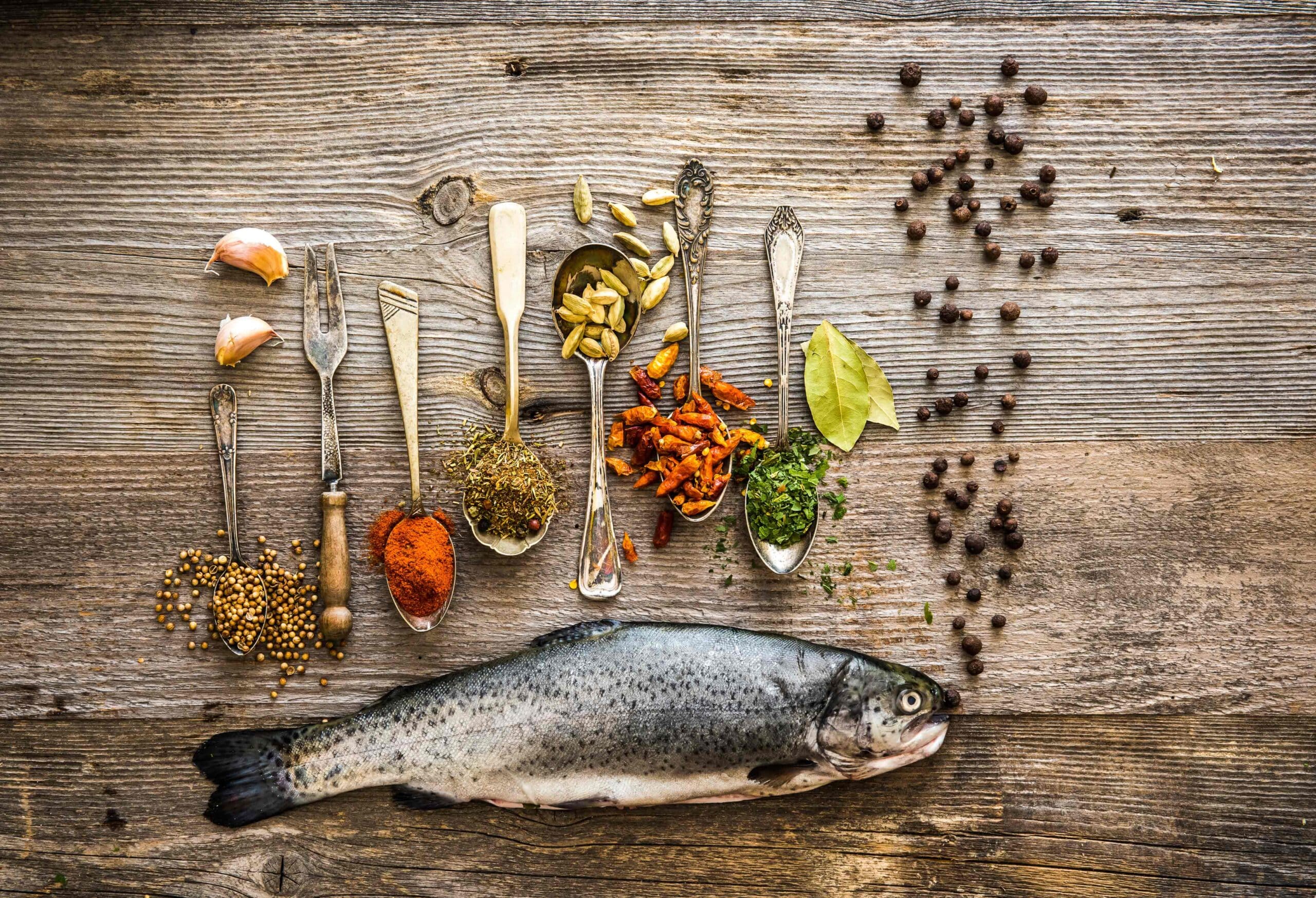 fresh-trout-with-seasonings-in-a-spoons