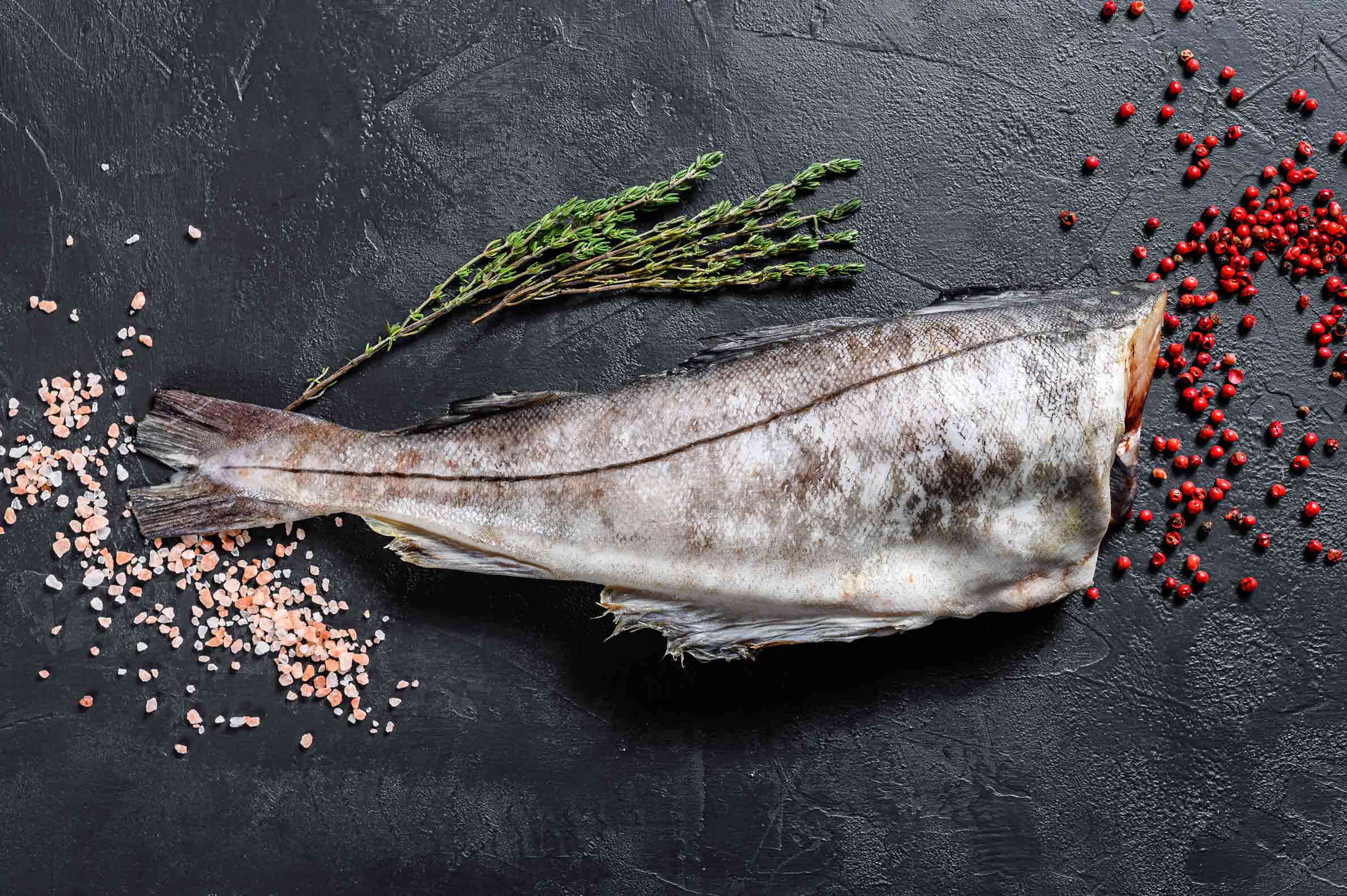 raw-haddock-fish-without-a-head-black-background-2024-12-09-02-31-11-utc